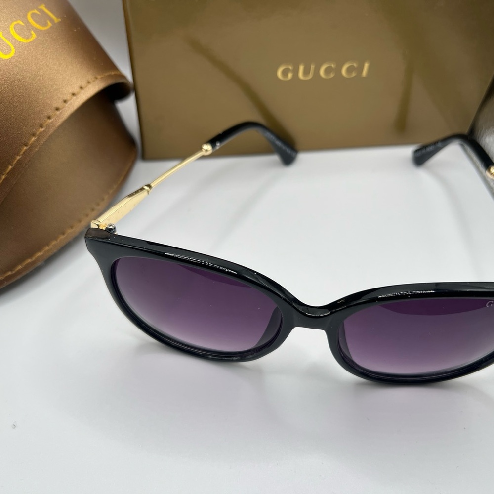 Women’s  Gucci black with purple tint
